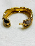 Swarovski vintage enamel, clear, crystal hinged bracelet, gold and black. (Preowned)