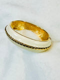 ELEGANT ST. JOHN GLOSSY CREAM ENAMEL GOLD-TONE ROPE DESIGN CUFF HINGED BRACELET (preowned)