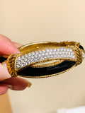 Swarovski vintage enamel, clear, crystal hinged bracelet, gold and black. (Preowned)