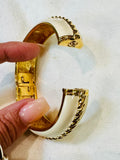 ELEGANT ST. JOHN GLOSSY CREAM ENAMEL GOLD-TONE ROPE DESIGN CUFF HINGED BRACELET (preowned)